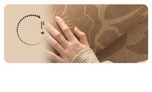 Detail showing the thick, soft texture and embossed leaf pattern of the brown knit rug