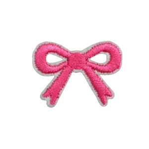 Pink bow embroidered patch for DIY bags with detailed stitch texture on white background