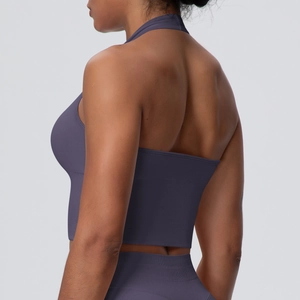 Detail of grey-purple ribbed seamless yoga set showing racerback cut and muscle fit