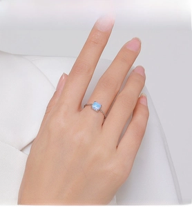 Macro view of square opal stone on minimalist silver chain ring for women