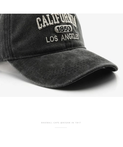 Close-up of vintage washed cotton baseball cap with detailed California 1850 embroidery