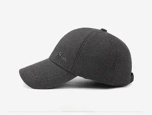 Detail view of dark grey waffle texture baseball cap with embroidered State logo on side