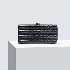Sleek dark grey acrylic marble texture clutch bag with horizontal grooves on white stand