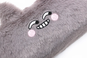 Close-up of grey plush pencil case featuring soft faux fur and a cute embroidered smiley face