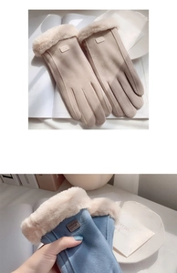 Detailed view of beige and blue winter suede gloves with plush faux fur trim and fashion label