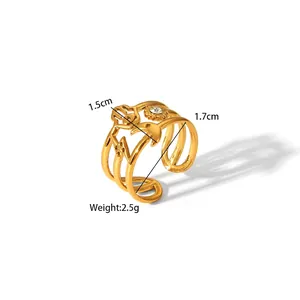 Detail of adjustable gold ring with bohemian moon and star patterns and zircon stone