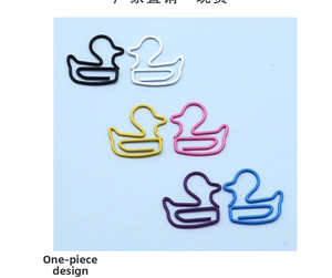 Close-up of duck-shaped colorful paper clips in black, white, yellow, pink, and blue