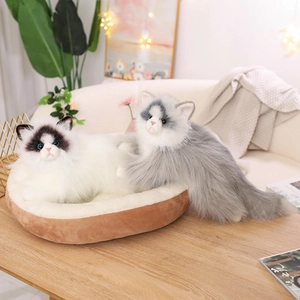 Realistic long-haired plush cats set in a cozy brown round pet bed for home decor