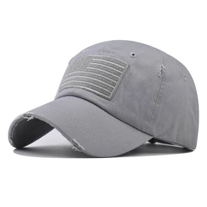 Detail of distressed grey cotton baseball cap with American flag patch and worn-out effects