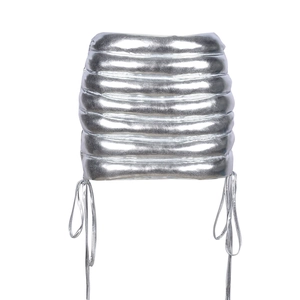 Detail of silver metallic puff mini skirt showing quilted texture and side drawstring