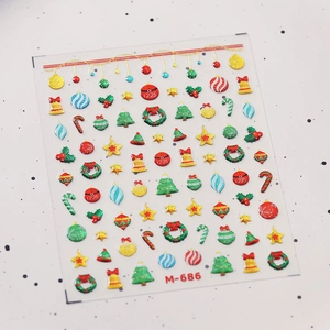 Detailed Christmas nail art stickers featuring festive bells, trees and wreaths
