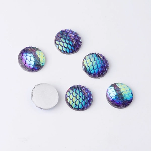 Close-up of 14mm round resin fish scale cabochons with blue and purple gradient AB colors