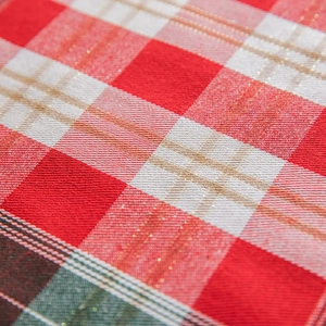 Christmas table runner with red gold plaid woven fabric texture and festive pattern