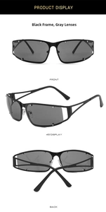 Close-up of metallic hollowed square sunglasses with silver rivets and futuristic temples