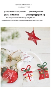 Close-up of iron Christmas ornaments including red star and white tree on wooden background