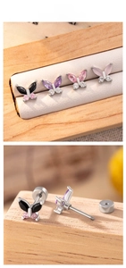 Macro detail of butterfly zircon earrings with screw back design in various colors