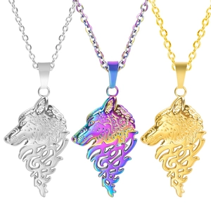 Detailed comparison of three wolf head pendants in silver, gold, and rainbow finishes