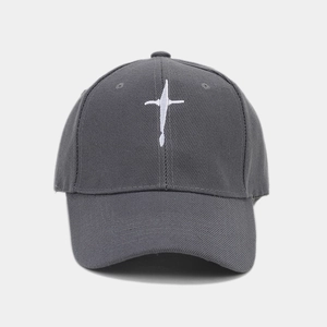 Close-up of deep gray cotton baseball cap featuring high-quality white star embroidery