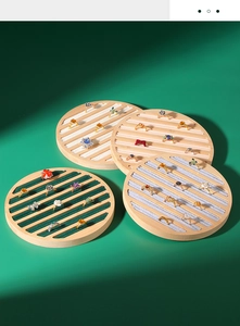 Bamboo wood round ring display tray with deep green velvet lining and multiple slots
