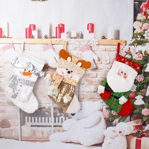 Three festive knit Christmas stockings featuring Santa, Reindeer and Snowman patterns