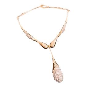 Elegant gold-tone irregular fluid teardrop pendant necklace with crystal rhinestones