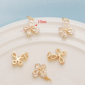 Detailed view of 10mm butterfly charms with 14K gold plating and inlaid zircon stones