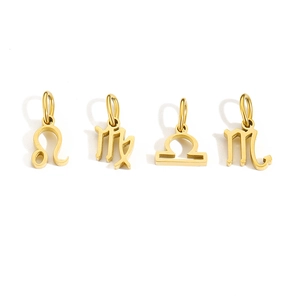 Detail of four golden stainless steel zodiac charms including Leo and Scorpio symbols