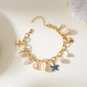 Golden starfish and shell charm bracelet for women with pearls for summer beach vacations