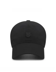 Detail of breathable perforated fabric and embroidered R logo on black sun cap
