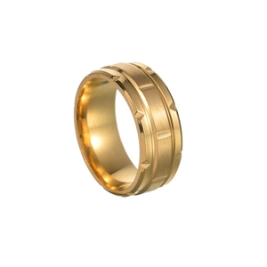 Macro view of wide gold titanium steel ring with brushed metal surface and geometric edges