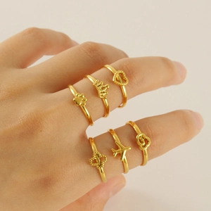 Chic 18k gold-plated stainless steel stackable rings set featuring clover and heart motifs