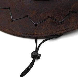 Close-up of brown faux leather cowboy hat with black woven drawstring and chin strap toggle