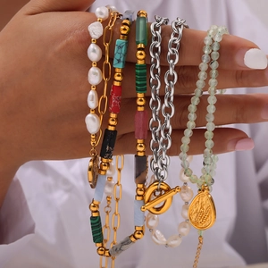 Elegant multi-layered gold titanium necklace with baroque pearls and natural stones
