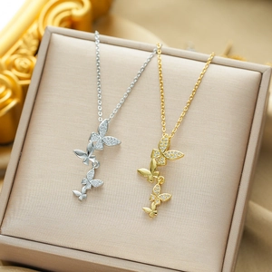 Elegant titanium steel butterfly tassel necklace with pavé crystals in gold and silver