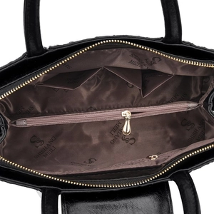 Top view showing spacious interior with brown lining and zipper pockets for a tote bag