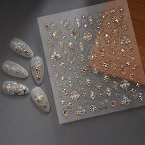 Golden baroque nail stickers with red and white rhinestones and floral vintage patterns