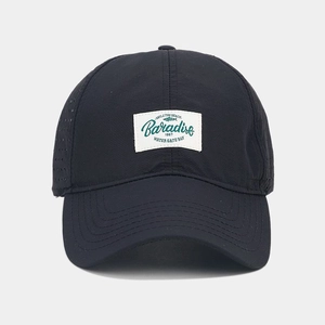 Detail of laser-cut side vents and Paradise patch on breathable quick-dry baseball cap