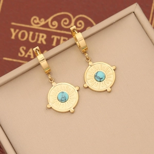 Macro view of gold-plated sunburst earrings with natural blue stone and marble pattern