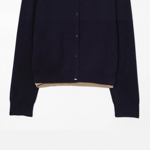 Navy blue color-block knit cardigan with beige layer detail and button-up front