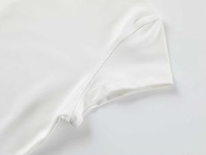 Close-up of sleeve stitching on white quick-dry fitness t-shirt showing fabric texture