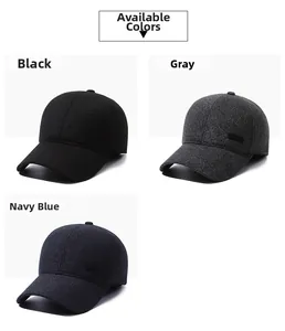 Close-up of winter baseball caps in black, grey, and navy blue with warm ear protection