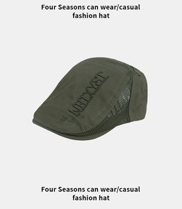 Detail of army green mesh beret featuring NETXYST embroidery and breathable fabric