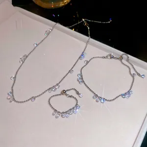 Elegant stainless steel jewelry set featuring zircon drop pendants on silver ball chains