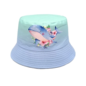Detailed view of kids' bucket hat with gradient mint blue and cute whale print