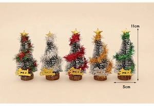 Detail view of five 11cm mini Christmas trees with gold stars and wooden bases