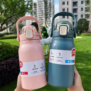 Close-up of pink and teal 304 stainless steel insulated bottles with handle and paper sleeve