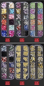 Detailed flat lay of 12-grid nail art boxes with mixed rhinestones and shells