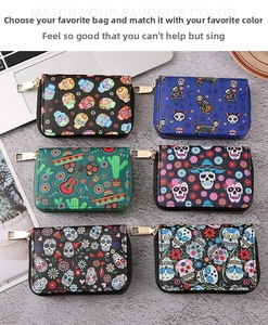 Detailed view of assorted PU leather accordion wallets with skull and gothic prints