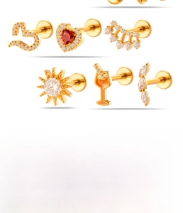 G23 titanium labret studs detail with heart and sun shapes set with zircon stones