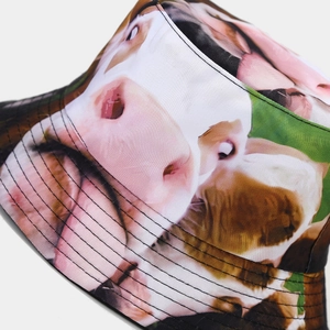 Detail of cow print bucket hat showing precise stitching and multi-layered brim texture